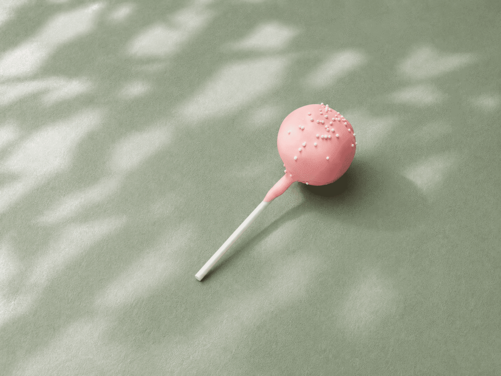 Starbucks Birthday Cake Pop with pink icing and white sprinkles