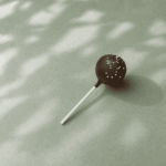 Starbucks Chocolate Cake Pop with chocolate icing and white sprinkles