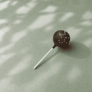 Starbucks Chocolate Cake Pop with chocolate icing and white sprinkles