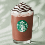 Starbucks Hot Chocolate with whipped cream and chocolate drizzle
